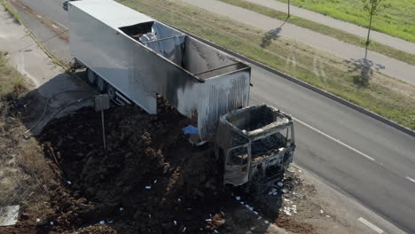 from close-up of burned truck to high altitude