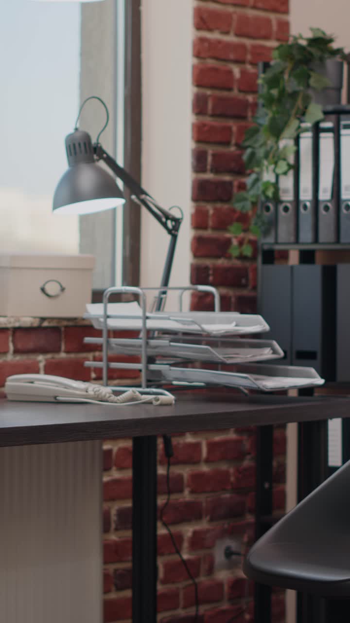 Woman working in office with box on desk