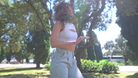 woman dancing in a park