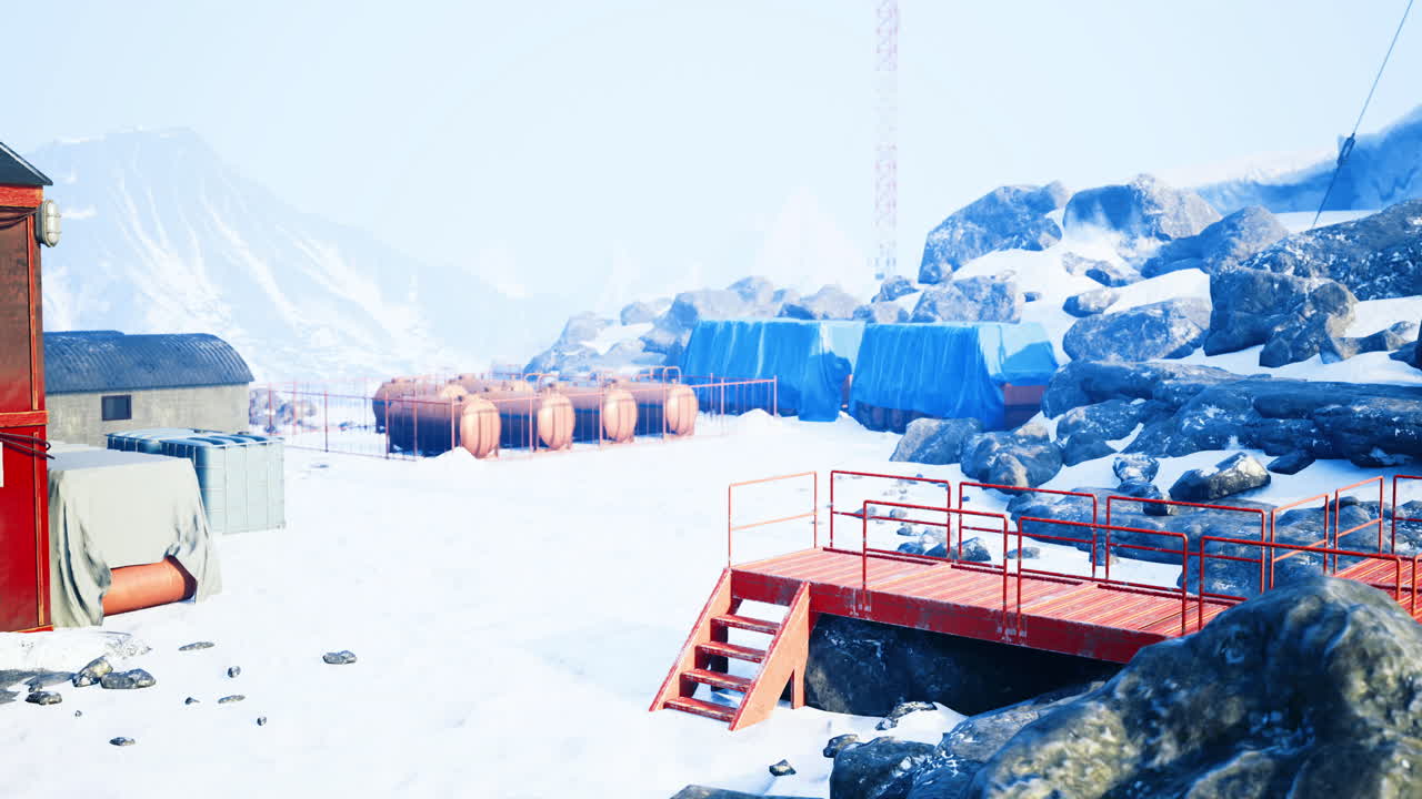 Snow covered research station with colorful tents in a wintry landscape