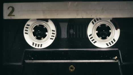 retro home entertainment cassette tape recorder playing close-up top down