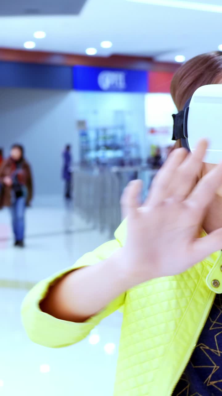 Woman Wearing VR Headset in a Shopping Mall