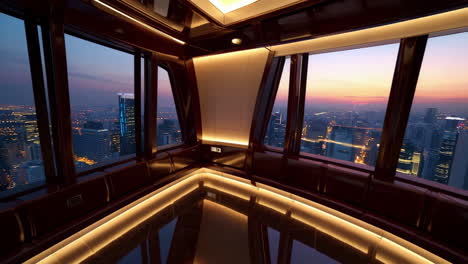 panoramic city view from a modern high-rise interior at dusk