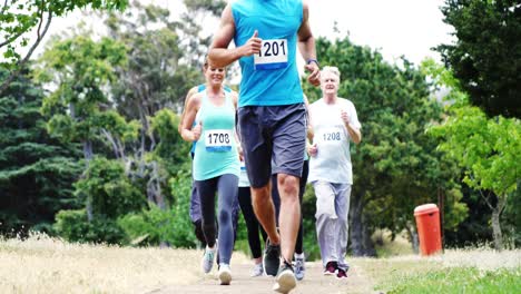 athletes running race in the park