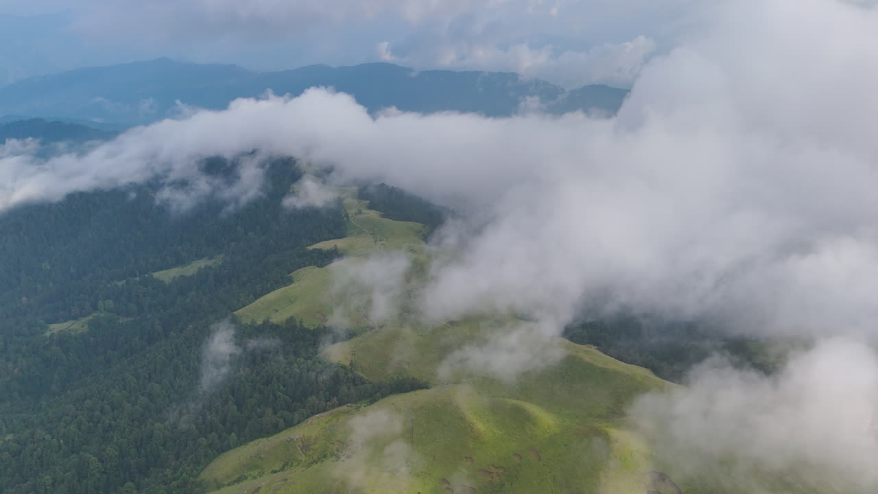 Cloud-covered landscape of Dolakha Sailung, Nepal, featuring lush green hills and mountainous terrains. picturesque and increasingly viral tourism spot near Tibet is a must-see for nature enthusiasts