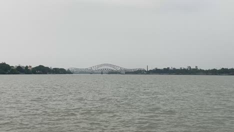 shot of jubilee bridge, former rail bridge over ganga river between naihati and bandel in west bengal, india on a bright sunny day