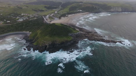 cinematic aerial flying over coast of east london south africa at sunrise