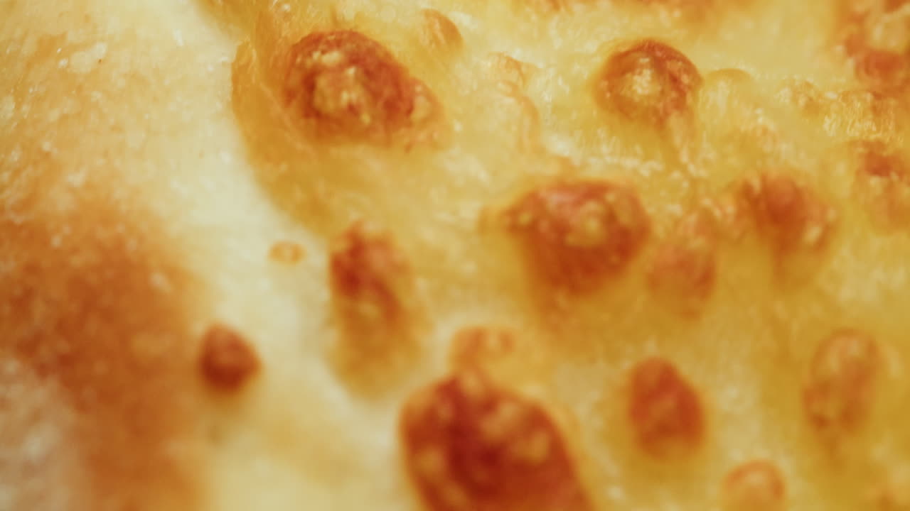 Close-up of a cheesy pizza slice