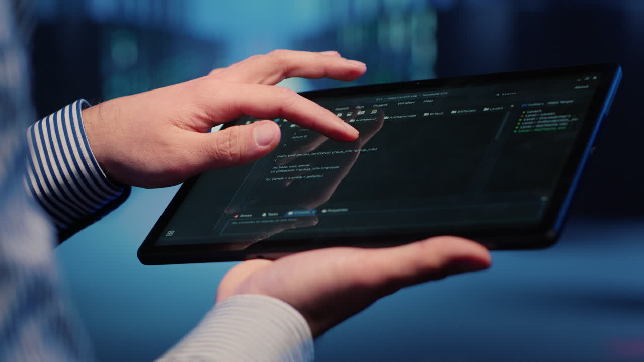 Male database technician looking at hosting server