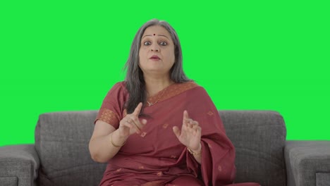 Happy-Indian-old-woman-talking-to-the-camera-Green-screen