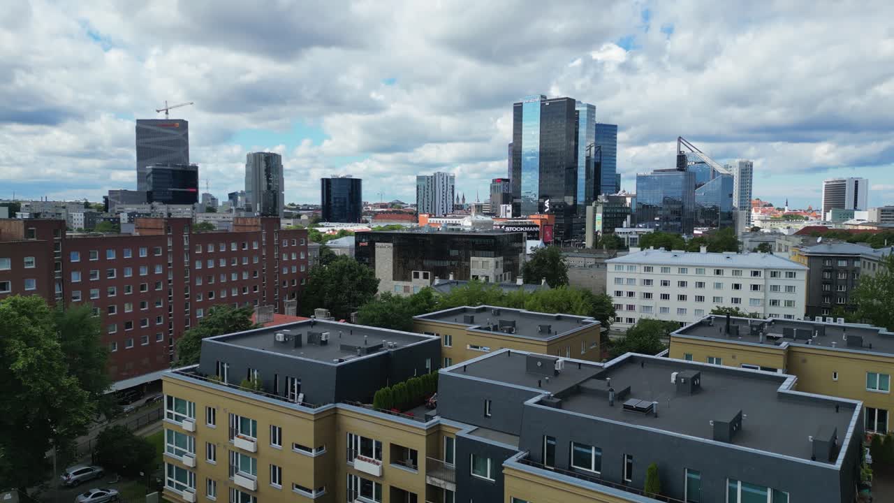 Low rooftop flyover: Cityscape skyline of Estonia capital city Tallinn