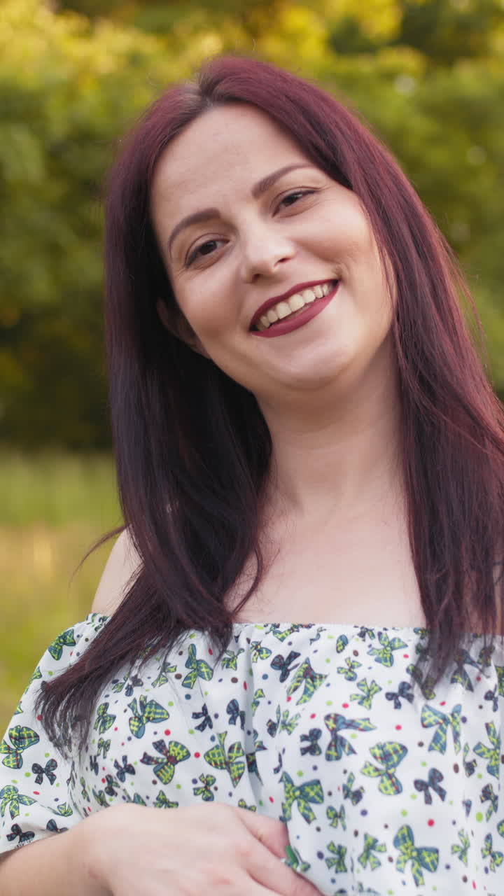 Smiling woman in a field vertical video