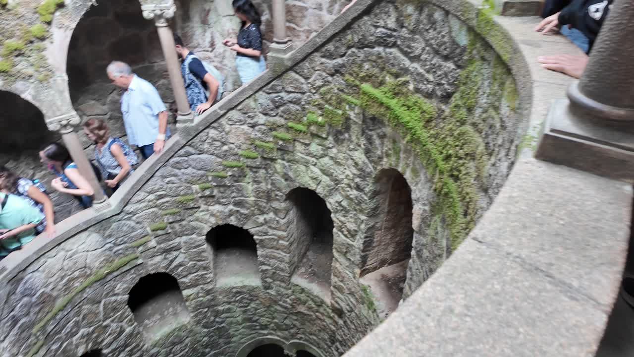 Visitors exploring the mystical Quinta da Regaleira in Sintra, Portugal