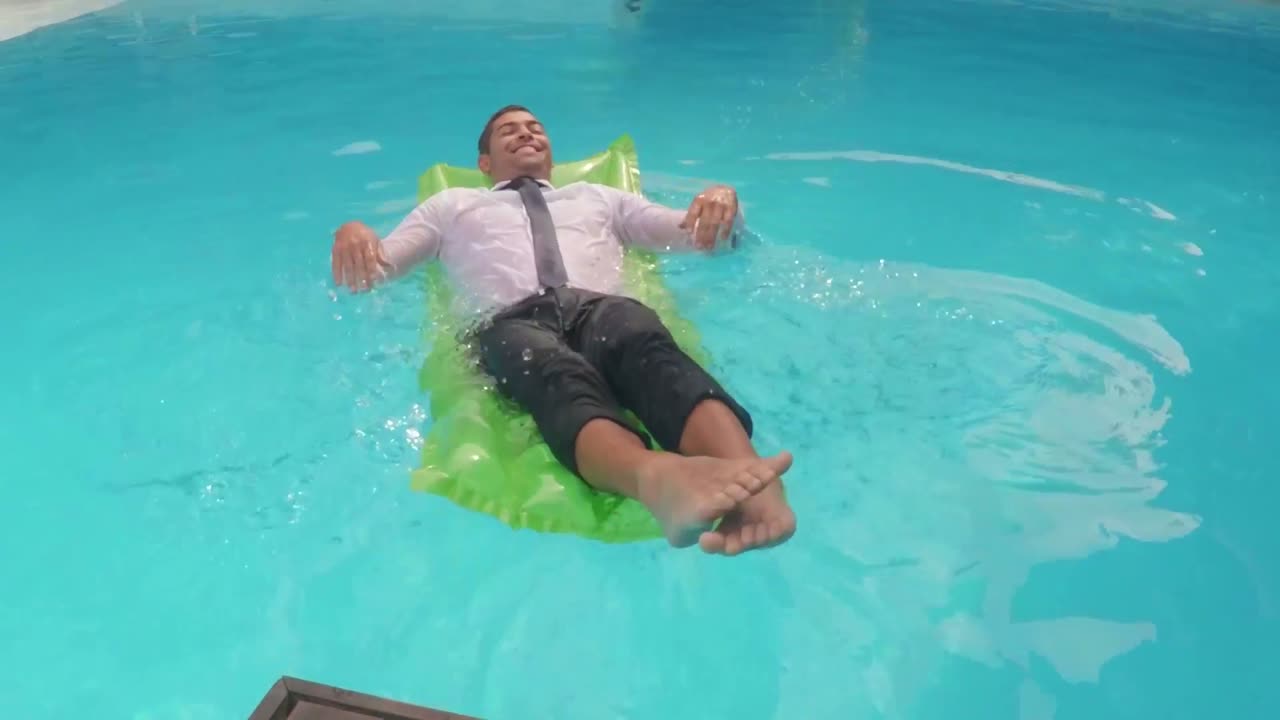 Businessman relaxing on lilo