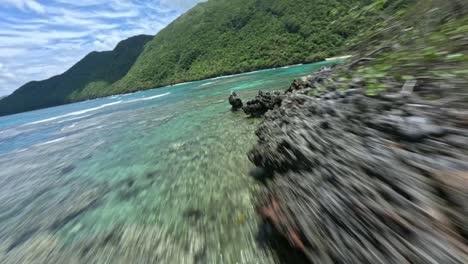 smooth dynamic racing fpv aerial on the tropical coast of the dominican republic