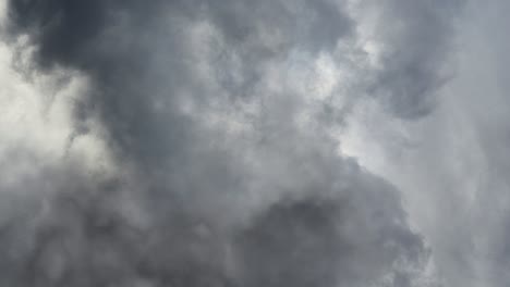 the dark sky and a flash, thunderstorms