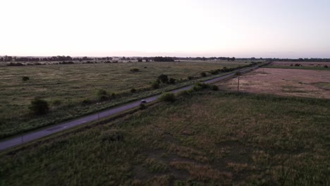 aerial view of a rural road through farmland