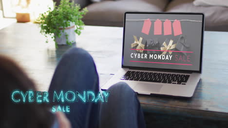 animation of cyber monday text over woman using laptop with presents on screen