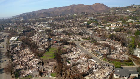 aerial view of a residential neighborhood devastated by wildfire