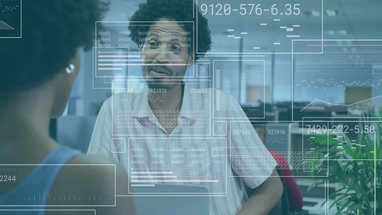 Woman addressing coworker at desk, conversation initiating digital overlays showing finance charts