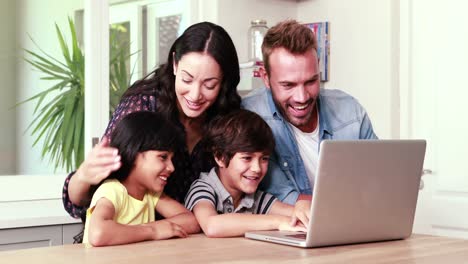 happy family doing video chat on laptop