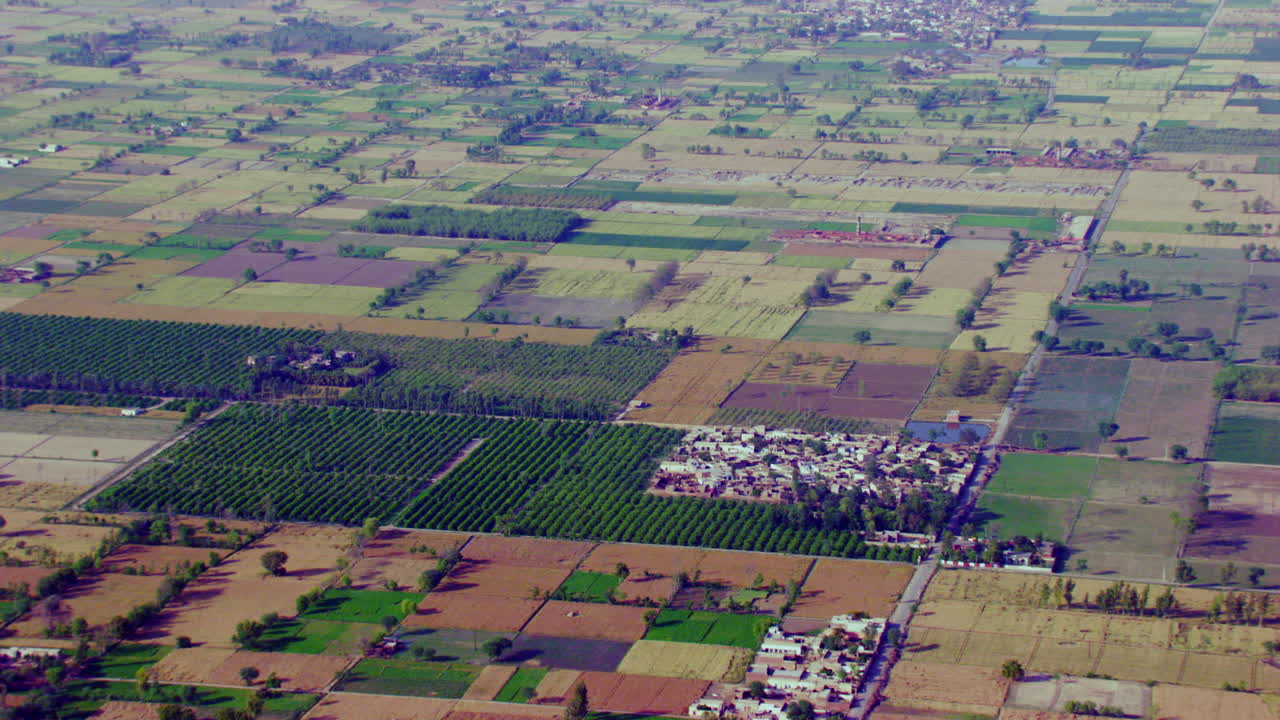 Aerial view of farm land and a small farming community in Oregon, Agricultural crops growing on farmland, India