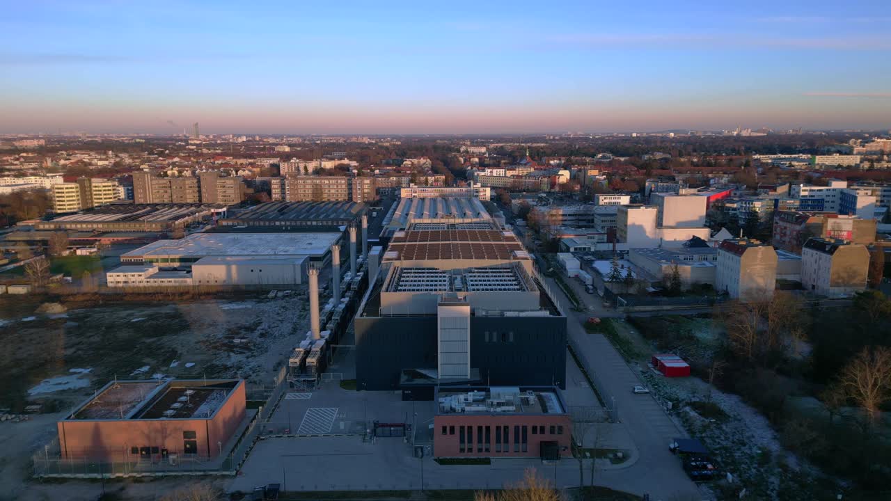 Large data center building processing information and connecting global network infrastructure. Amazing aerial view flight drone shot from above