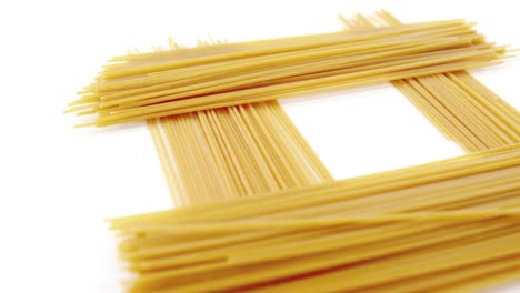 Raw-spaghetti-on-white-background