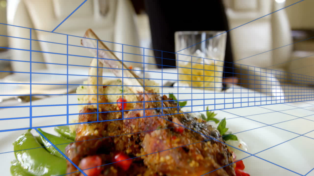 Chef presenting lamb chops with grains and herbs in business travel cabin, overlaying blue grid