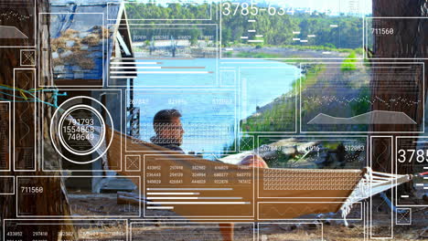digital data interface animation over person relaxing by lakeside cabin
