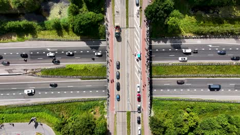 aerial view of highway intersection with traffic and people