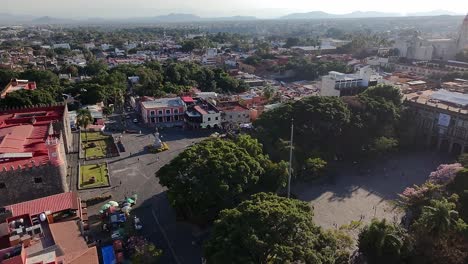 the palace of cortés and central plaza surrounded by trees in cuernavaca. cuernavaca, morelos