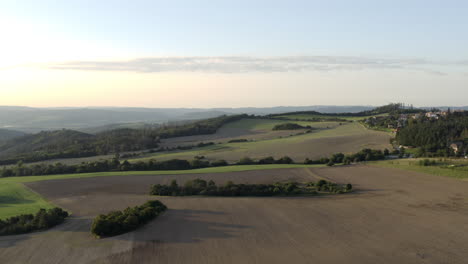 aerial shot of beautiful countryside landscape in czech republic, farm fields and mountains