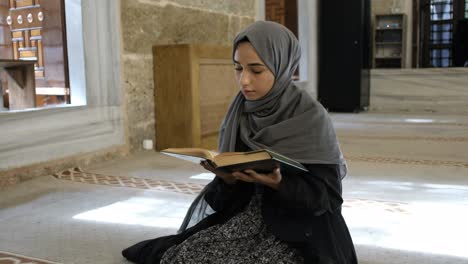 muslim believer woman reading holly quran