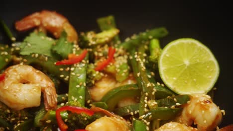 Unrecognizable-person-eating-appetizing-seafood-with-chopsticks