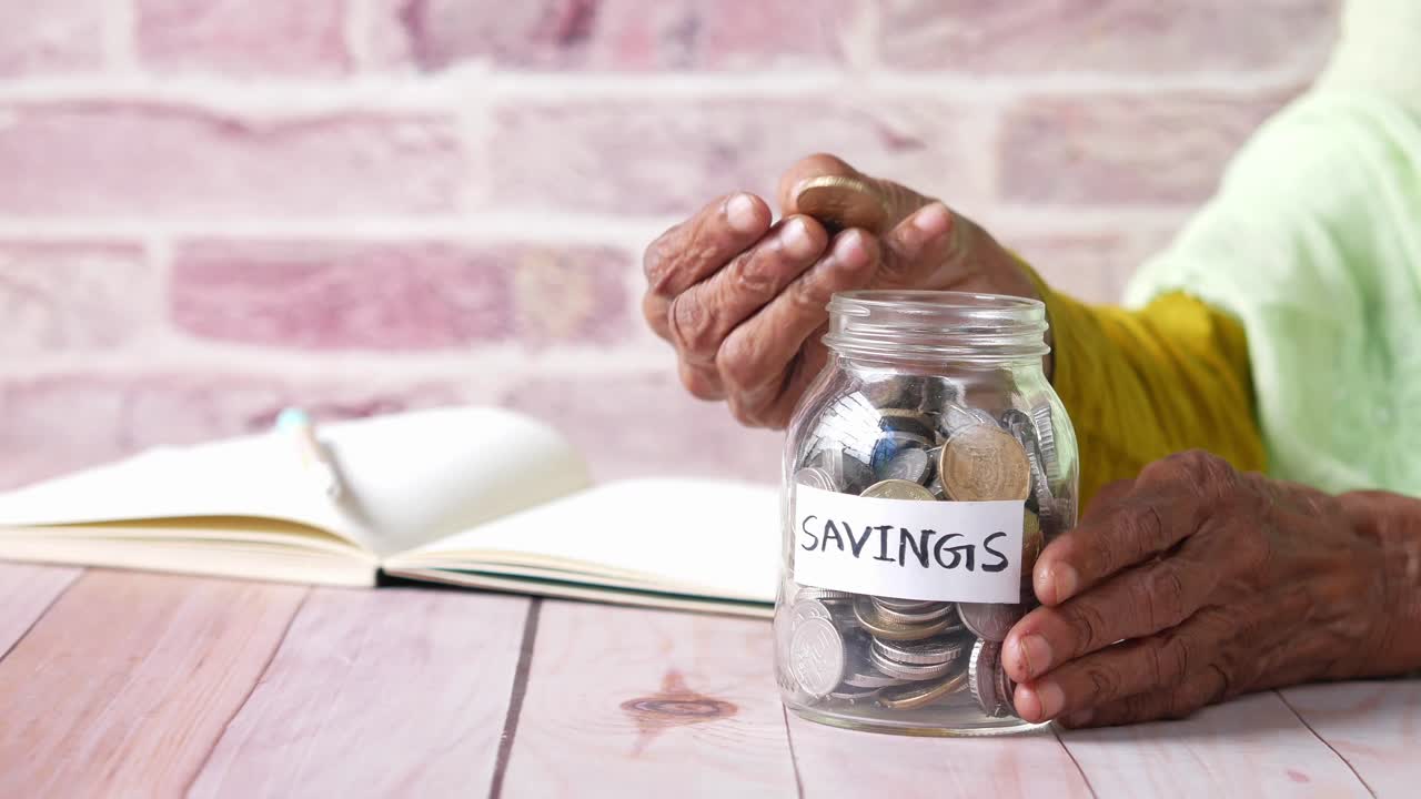 Elderly Person Saving Money
