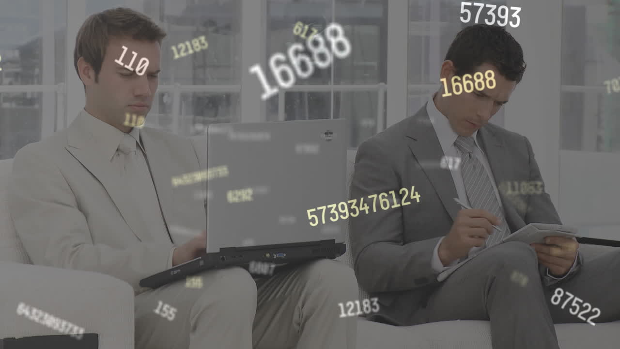 노트북을 사용하고 메모를 작성하는 두 개의 비즈니스에 대해 떠다니는 여러 개의 변경 숫자