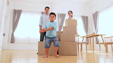 happy funny asian family in new house