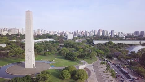 obelisco monument and buildings in sao paolo's business center near avenida paulista- long aerial slow-moving drone shot