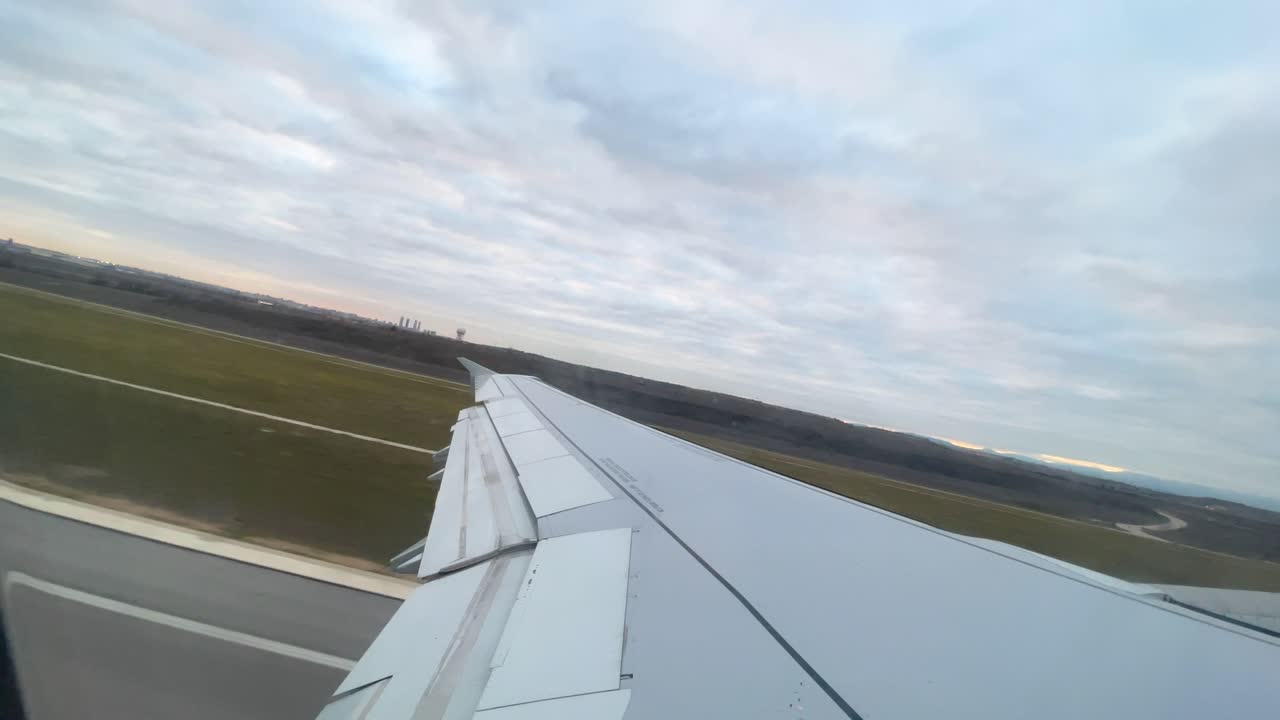 International flight images from the window of the plane flying over the clouds to that of the aircraf Takeoff