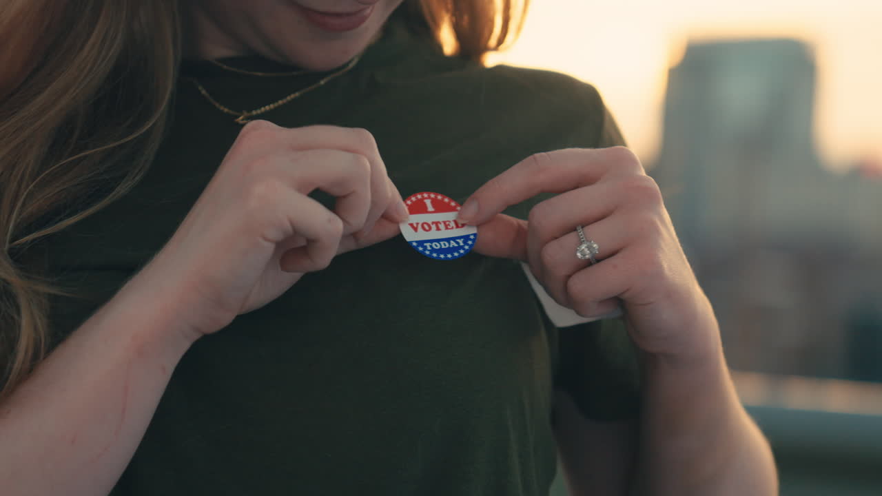 A woman wearing an I Voted sticker