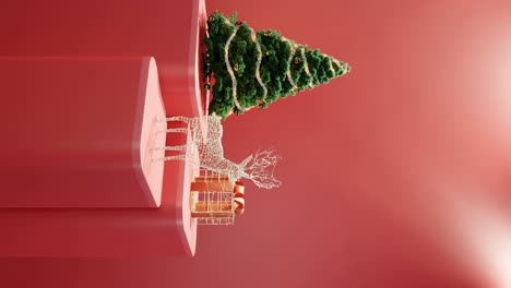 Christmas-Tree,-Illuminated-Reindeer,-and-Wrapped-Gift-on-red-background-vertical