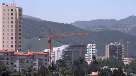 construction crane turns while lifting a load