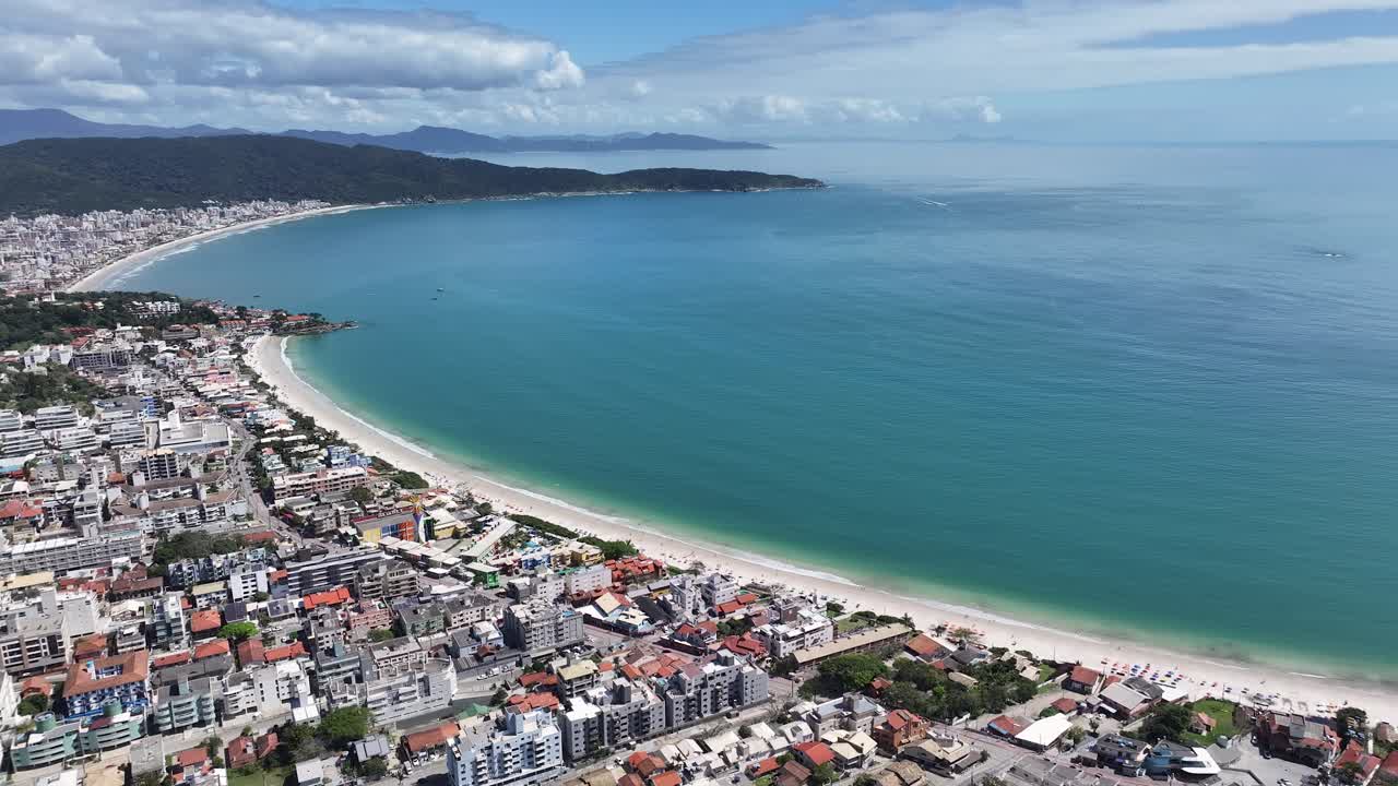 Aerial View of a Coastal City with a Beautiful Beach
