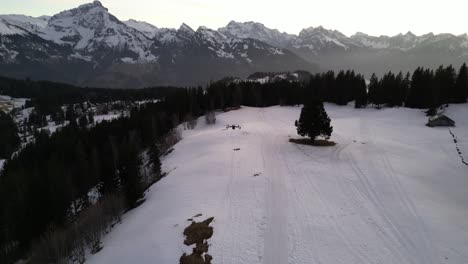 Amden-Weesen-Switzerland-drones-takes-off-into-the-colourful-sky-after-sunset