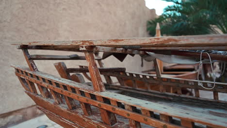 an old traditional dhow displayed in old dubai street at al fahidi historical neighbourhood, united arab emirates