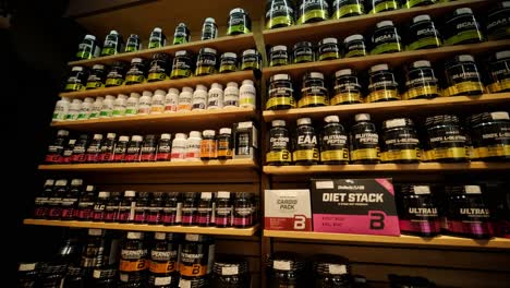 sport nutrition store interior with large choice of nutritional supplements.