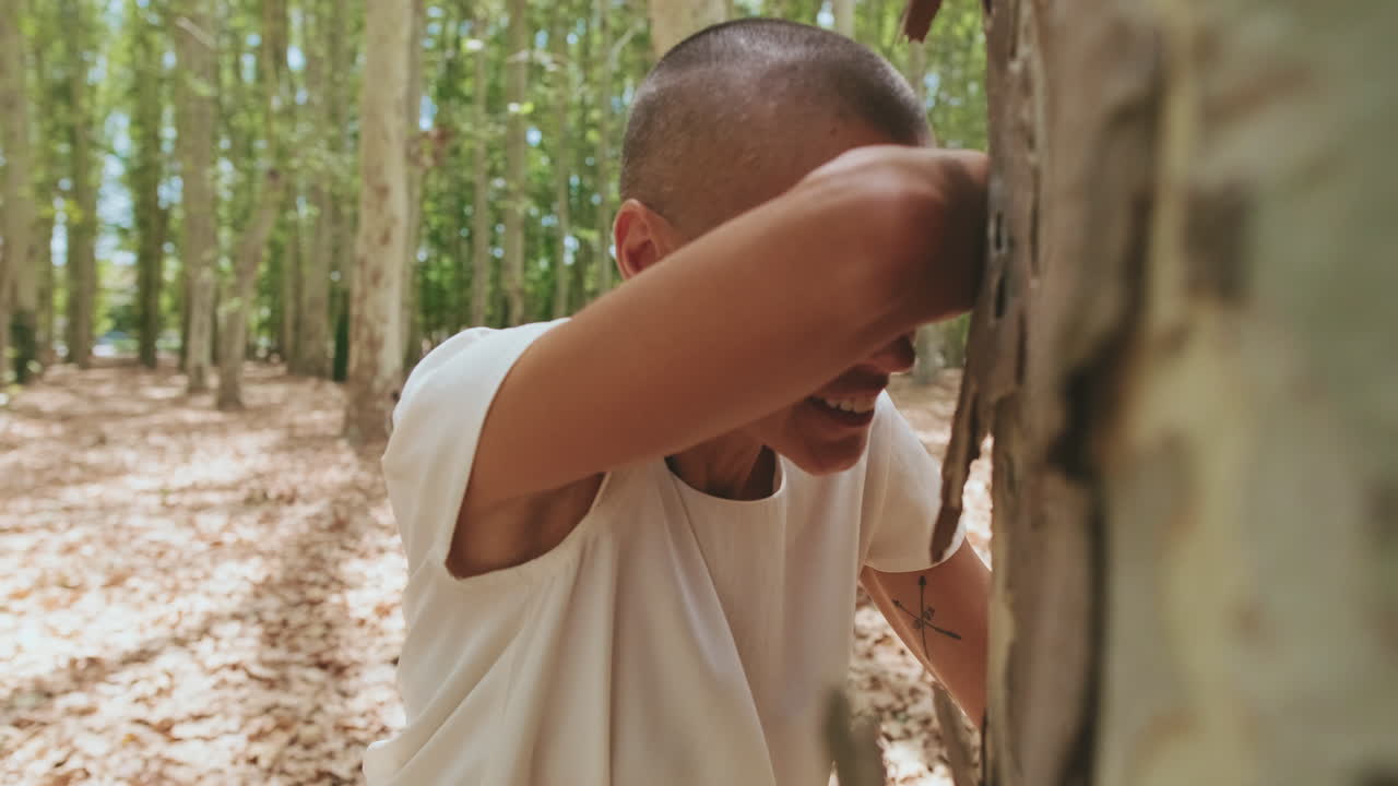 Mother Playing Hide and Seek with Family in a Sunny Forest
