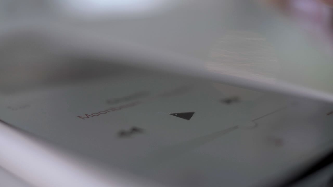 Girl turns on music on the player or phone