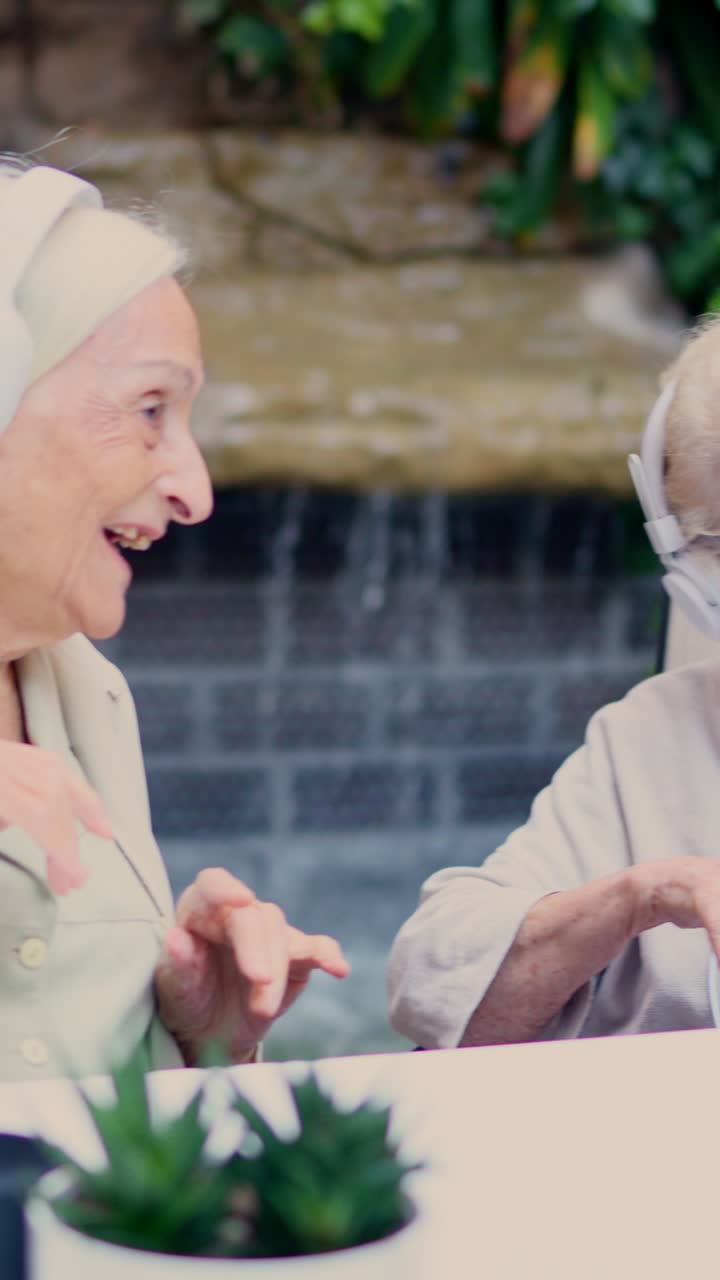 Elderly people enjoying music and company in a garden
